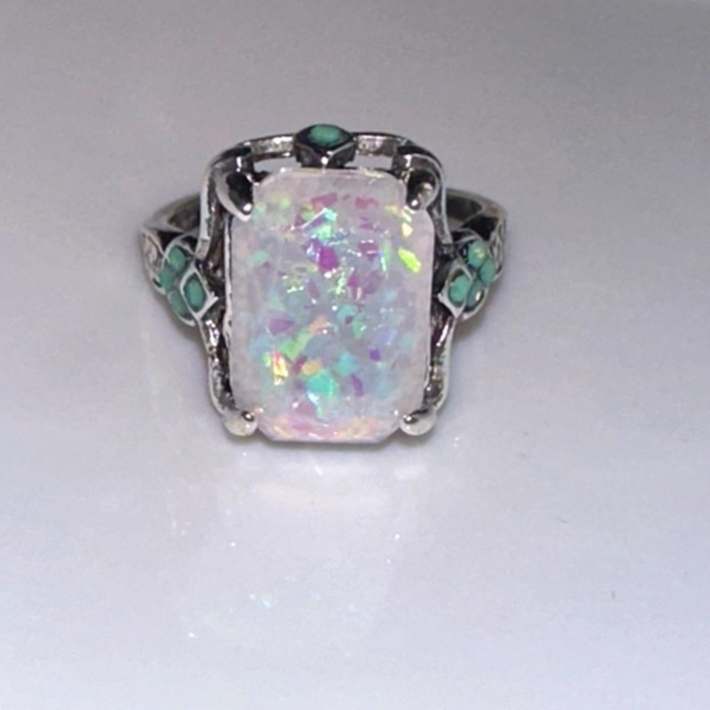 Lab opal ornamental ring. 4.25 carats. With turquoise accents